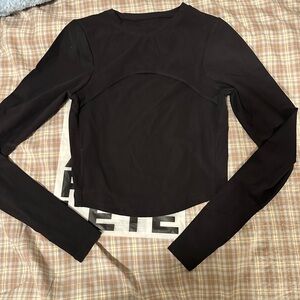 Brand new Alphalete peek-a-boo black long sleeve Top.